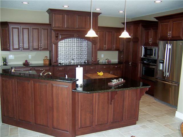 Kitchen featuring a wood cooking enclosure with an exhaust hood hood
